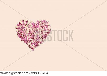 Pink Cream Sugar Is A Variety Of Sprinkles For Confectionery. Flat Lay In The Shape Of A Heart, On A