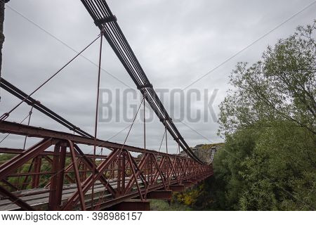 Historic Bridge Stone And Streel Suspension Structure At Ophir Crossing Manuherikia River In Central