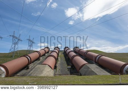 Four Large Pipes Or Penstock Supplying Water By Gravity To Electric Power Station At Ohau B Station.