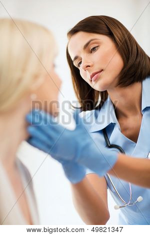 healthcare, medical and plastic surgery concept - plastic surgeon or doctor with patient