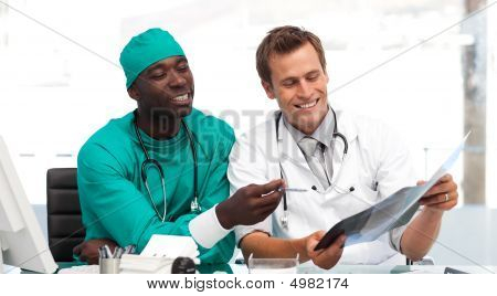 Doctor And Surgeon Looking At An Xray