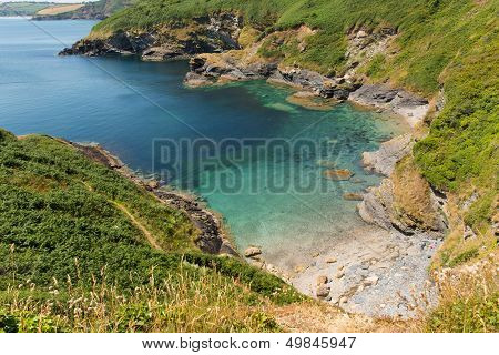Secluded beach and cove with turquoise sea Black Head headland St Austell Bay
