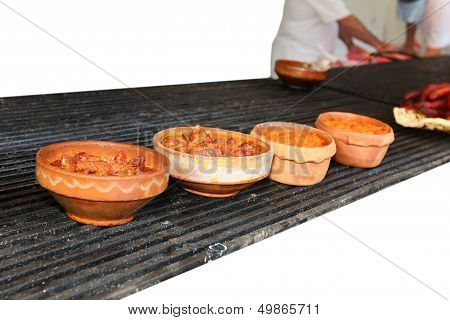 Food Is Served In Ceramic Pots