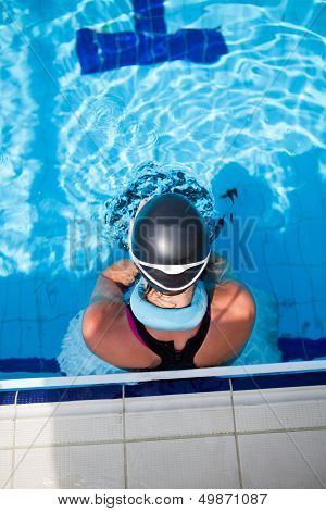 Female Swimmer At Pool Edge