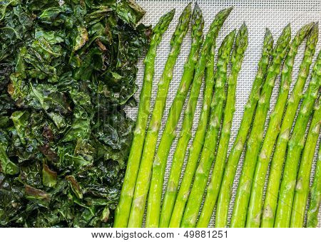 Kale And Asparagus Being Roasted In Oven