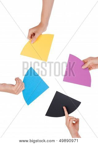 People Holding Colorful Pieces