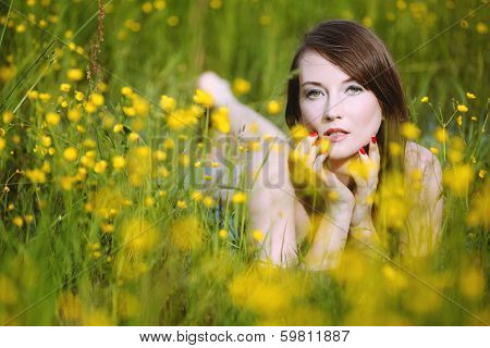 Beautiful woman in flowery meadow