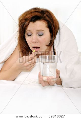 Red Hair Woman With Hangover Taking Headache Pill