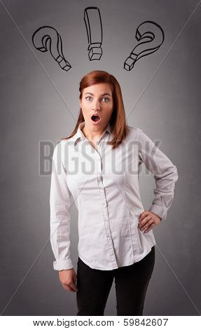 Beautiful young lady thinking with question marks overhead