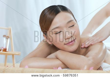 .a Young Woman Enjoying Massage.