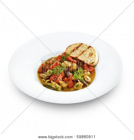 Delicious healthy backed rapana meat served with tomatoes and sweet onion in tomato sauce with toasted bread. Gourmet sea food isolated on white. 