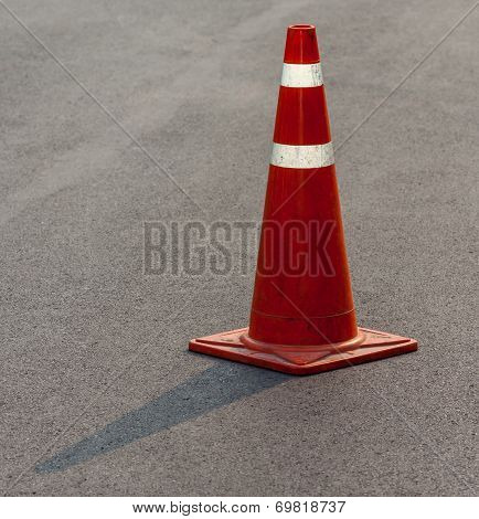 Grunge Traffic Cone With Double White Stripe On The Street