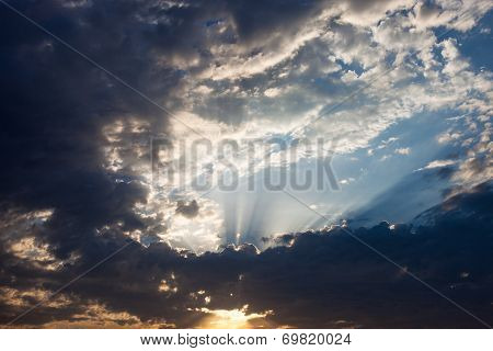 Cloudscape With The Sun Rays Radiating From Behind The Cloud