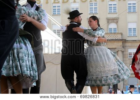 ZAGREB, CROATIA - JULY 19: Members of folk groups Nograd  from Salgotarjan, Hungary during the 48th International Folklore Festival in center of Zagreb, Croatia on July 19, 2014