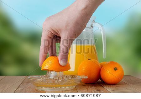 Hand Squeezing Fresh Orange