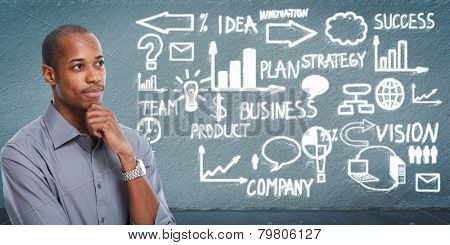Black businessman looking business scheme. Creative background