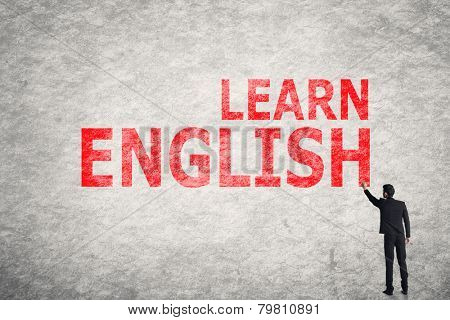 Asian businessman write text on wall, Learn English 