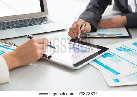 Image of human hands during paperwork at meeting