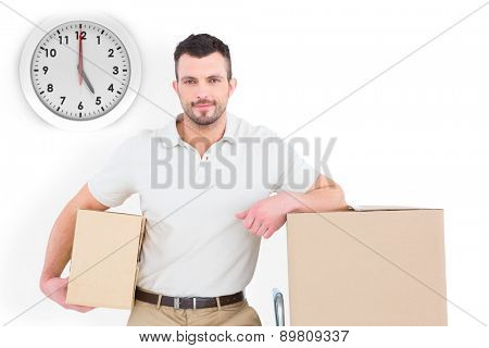 Delivery man with trolley of boxes against five o clock