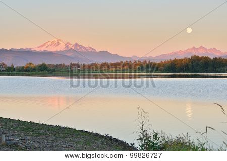 Full Blue Moon Over Mt. Baker And Three Sisters Mountain