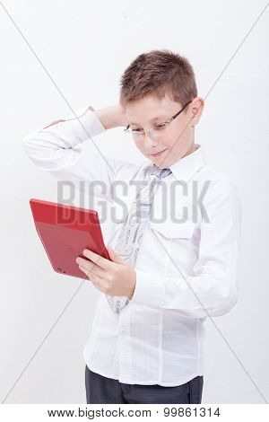 Portrait of teen boy with calculator on white background