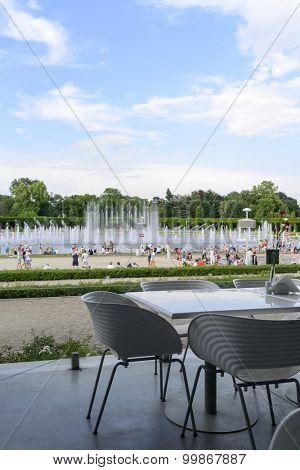 WROCLAW - JULY 19: The view from the empty restaurant on people cooling using public fountains in the hottest day on 19 July 2015 in Wroclaw, Poland. In this year there was a record high temperature.