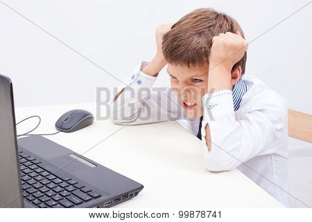 Boy using his laptop computer