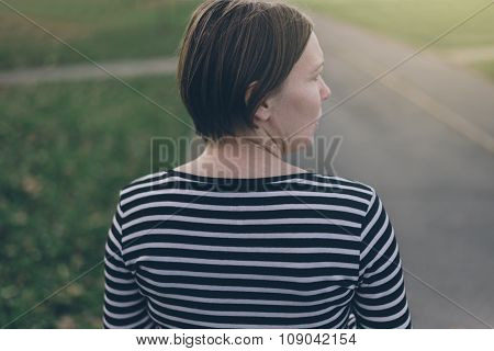 Alone Casual Woman Walking Down The Street