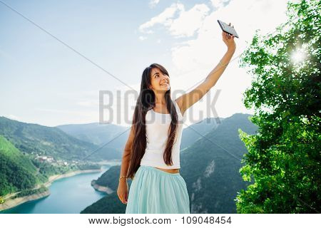 Happy Girl Taking Selfie Photo On Telephone