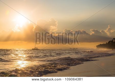 Golden Sunrise Over Ocean With Alone Boat In Dominican Republic