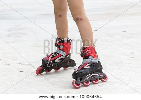 Enjoying roller skating rollerblading on inline skates sport in park. Outdoor activities. Part of human legs in sport shoes.