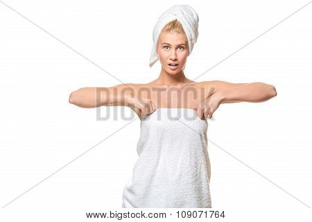 Young attractive woman with blue eyes in a towel