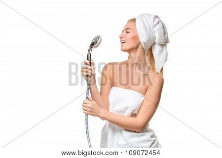 Happy pretty woman in towel singing using shower having fun