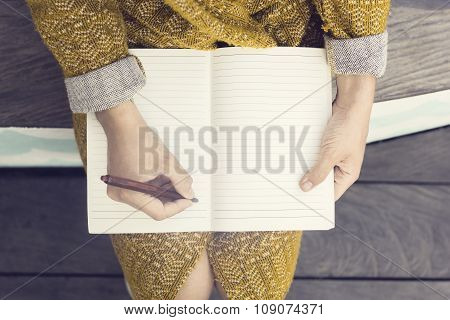 Hipster Girl With Blank Diary And Pen Sitting On Wooden Bench