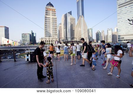 SHANGHAI, CHINA, 25 JULY, 2015:Visitors in Shanghai. Tourists in the Shanghai Lujiazui financial and Trade Zone at 25 July, 2015