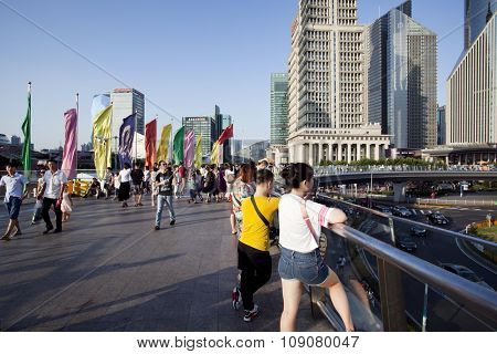 SHANGHAI, CHINA, 25 JULY, 2015:Visitors in Shanghai. Tourists in the Shanghai Lujiazui financial and Trade Zone at 25 July, 2015