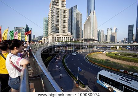 SHANGHAI, CHINA, 25 JULY, 2015:Visitors in Shanghai. Tourists in the Shanghai Lujiazui financial and Trade Zone at 25 July, 2015