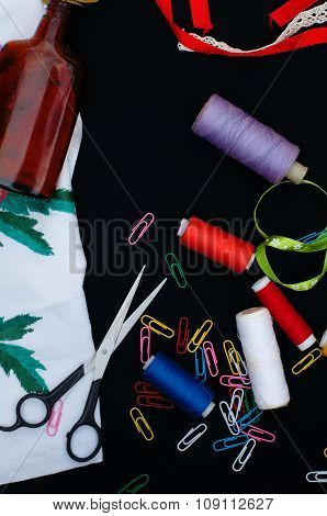 Scissors, bobbins with thread. Set of colored threads in the bobbin with scissors. Sewing kit. Sewin