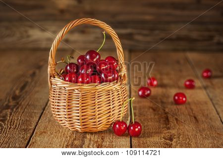 Ripe Sweet Red Cherries in Wicker Basket