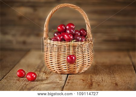 Ripe Sweet Red Cherries in Wicker Basket