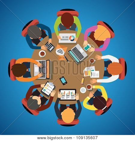 Eight people team sitting and working together