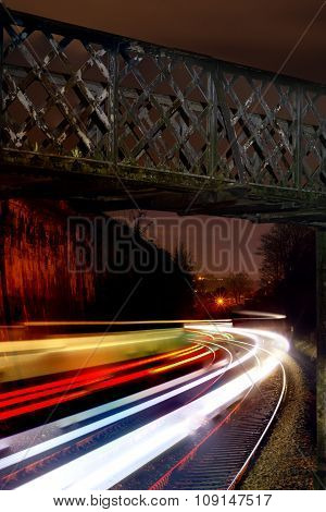 Train light trails on Great Western Railway at night