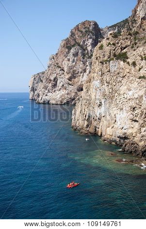 Masua's Sea Stack Daily And Some Boats In Summertime (sardinia-italy)