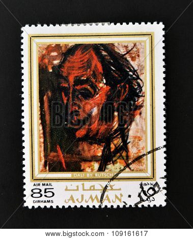 AJMAN - CIRCA 1970 A stamp printed in Ajman shows Dali portrait by Alexander Rutsch circa 1970