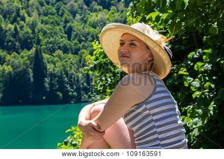 Sitting woman tourist looking away