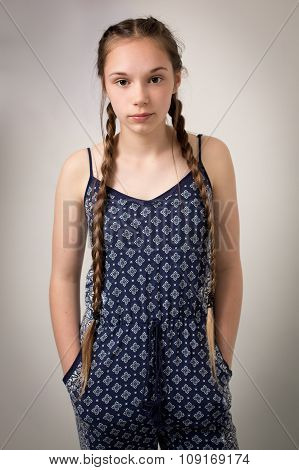 Beautiful Teenage Girl With Plaits And Onesie