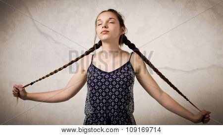 Beautiful Teenage Girl With Plaits And Onesie