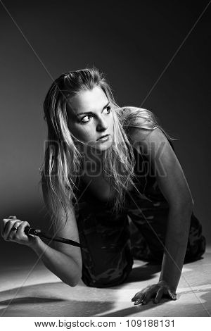 Sexy woman holding dagger
