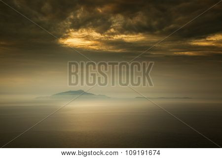Mist Surrounds The Italian Islands Of Isola D'ischia And Procida
