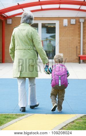 Grandmother Taking Grandson To School